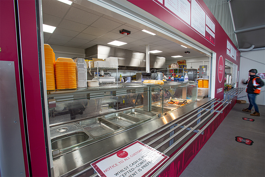 Construction site canteen temporary structure with Kitchen space installed through gable side