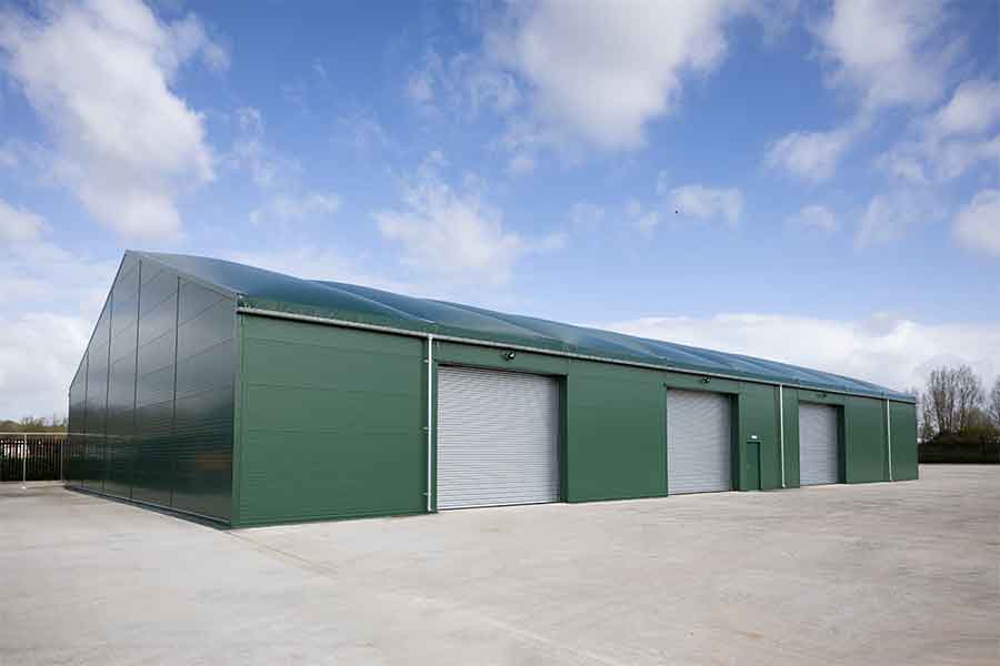 Insulated temporary building with sandwich panel walls